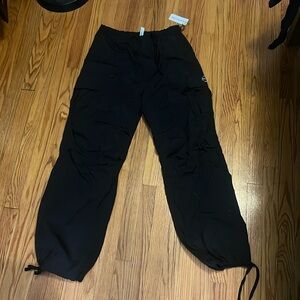 Black parachute pants. From PINK.